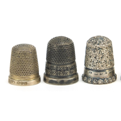 2418 - Six silver thimbles, various hallmarks including Charles Horner, the largest 2.7cm high, total 23.0g