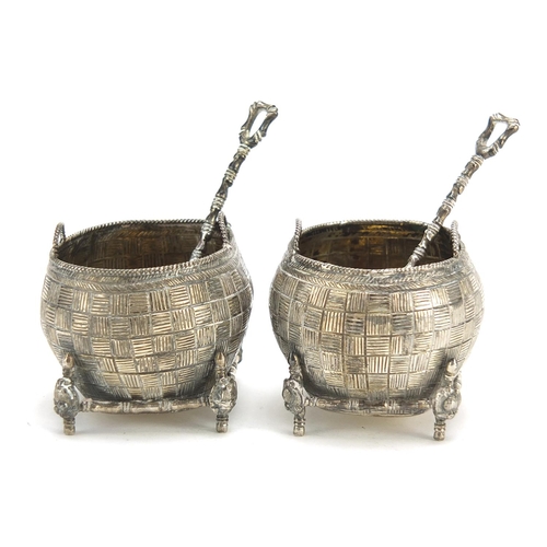 71 - Pair of Chinese silver open salts with spoons in the form of baskets, the spoons with coin bowls, th... 