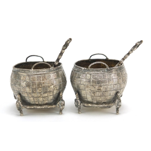 71 - Pair of Chinese silver open salts with spoons in the form of baskets, the spoons with coin bowls, th... 