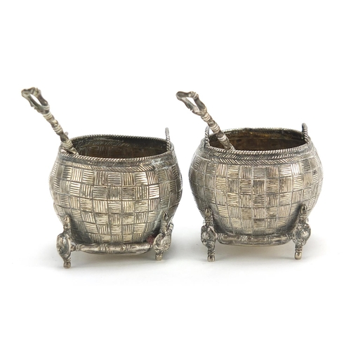 71 - Pair of Chinese silver open salts with spoons in the form of baskets, the spoons with coin bowls, th... 