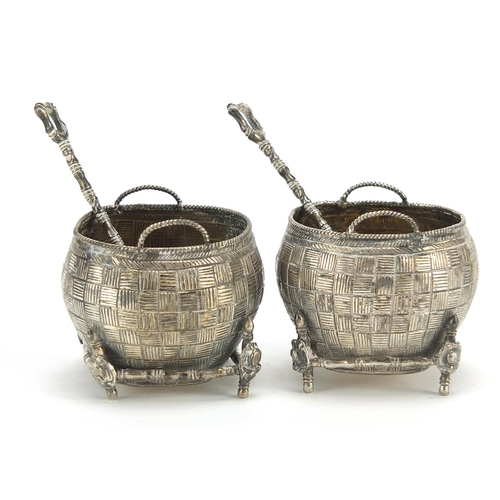 71 - Pair of Chinese silver open salts with spoons in the form of baskets, the spoons with coin bowls, th... 