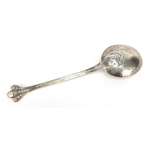 2330 - Large Arts & Crafts unmarked silver spoon with planished bowl and stylised terminal, 28cm in length,... 