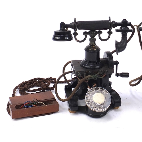 269 - Two early 20th century Ericsson no 16 dial telephones and a Elements of Telephony book, each telepho... 