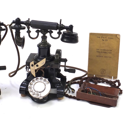 269 - Two early 20th century Ericsson no 16 dial telephones and a Elements of Telephony book, each telepho... 