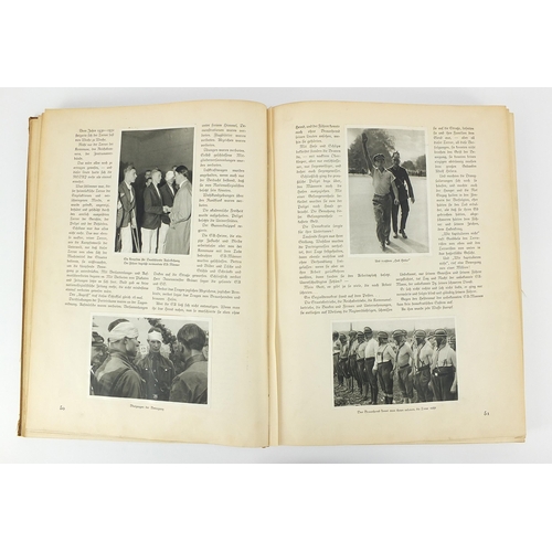 2467 - German propaganda book promoting the Nazi party with photographs inserted