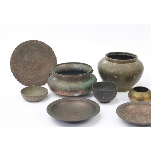 200 - Indian, Islamic and Persian metalware, some with silver inlay including water pot, bowls and dishes,... 
