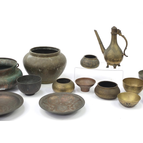 200 - Indian, Islamic and Persian metalware, some with silver inlay including water pot, bowls and dishes,... 