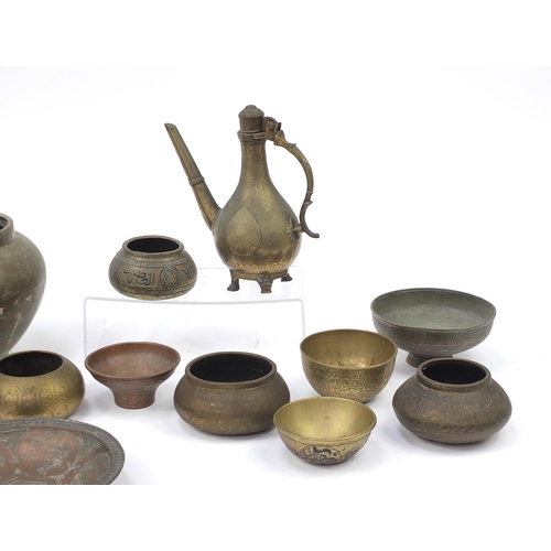 200 - Indian, Islamic and Persian metalware, some with silver inlay including water pot, bowls and dishes,... 