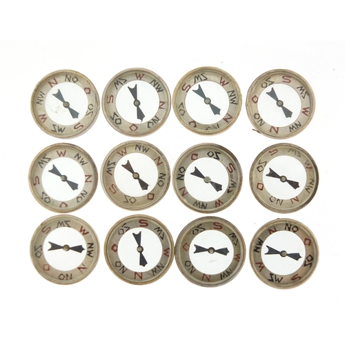 2438 - Twelve German military interest Luftwaffe emergency compasses with box