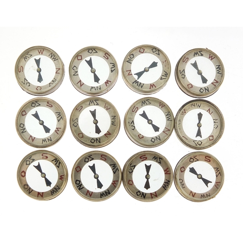 2438 - Twelve German military interest Luftwaffe emergency compasses with box