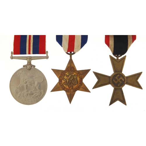 2440 - Two British military World War II medals and a German example