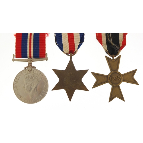 2440 - Two British military World War II medals and a German example