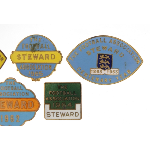 2476 - Five 1960's Football Association Steward badges