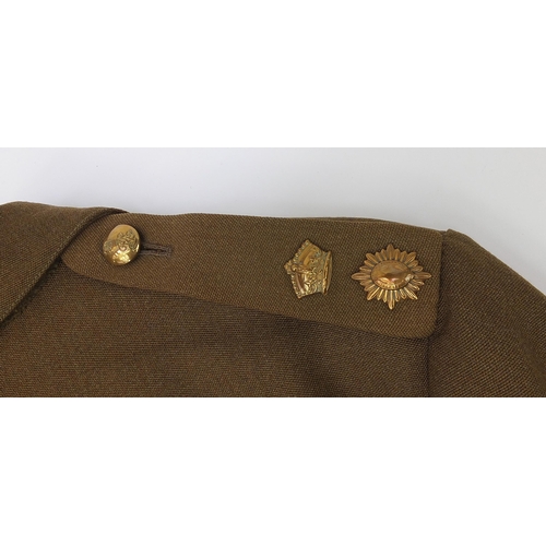 2465A - Three military interest No 2 uniforms for the Life Guards with brass badges on the front, rank badge... 