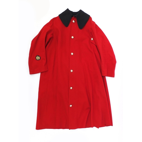 2460A - Military interest Red Life Guard's long coat with a Regimental Sergeant Major badge on the right sle... 