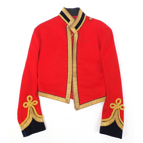 2460A - Military interest Red Life Guard's long coat with a Regimental Sergeant Major badge on the right sle... 