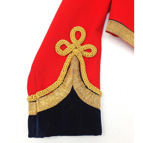 2460A - Military interest Red Life Guard's long coat with a Regimental Sergeant Major badge on the right sle... 