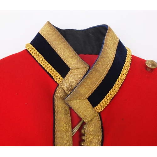 2460A - Military interest Red Life Guard's long coat with a Regimental Sergeant Major badge on the right sle... 