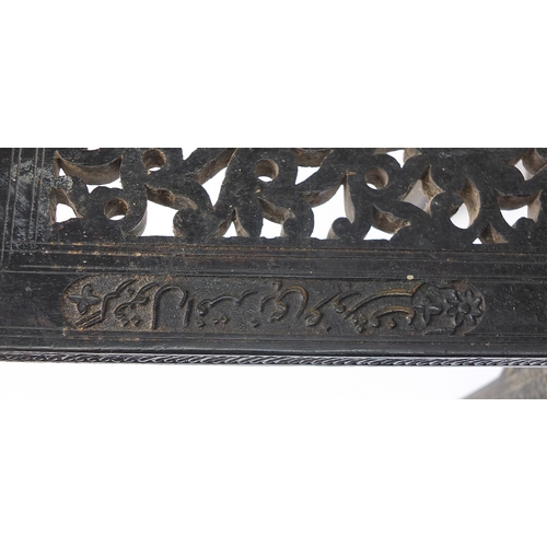 202 - Anglo Indian ebonised hardwood folding bookrest carved with flowers and calligraphy, 42cm high