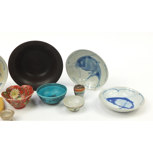 1091 - Chinese, Japanese and Persian ceramics including a blue glazed bowl hand painted with fish, the larg... 