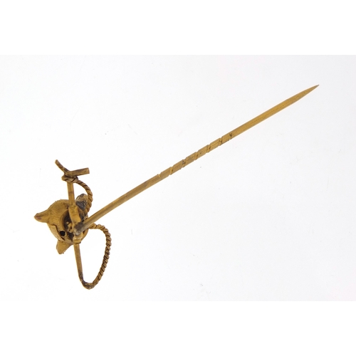 1762 - Victorian unmarked gold fox head and riding crop stick pin, 5.5cm in length, 1.4g