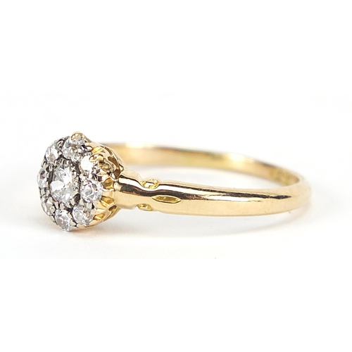 1676 - 18ct gold diamond cluster ring, the central diamond approximately 2.5mm in diameter, size Q/R, 2.7g