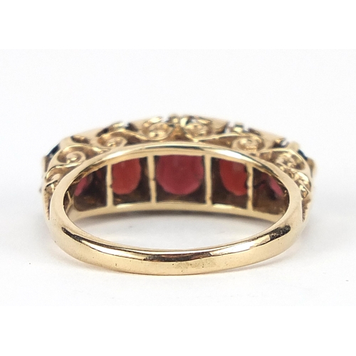 1678 - 9ct gold graduated garnet and diamond ring, size N, 4.8g