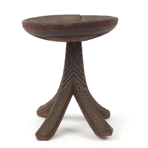 190 - African tribal interest carved stool, 34cm high x 31cm in diameter