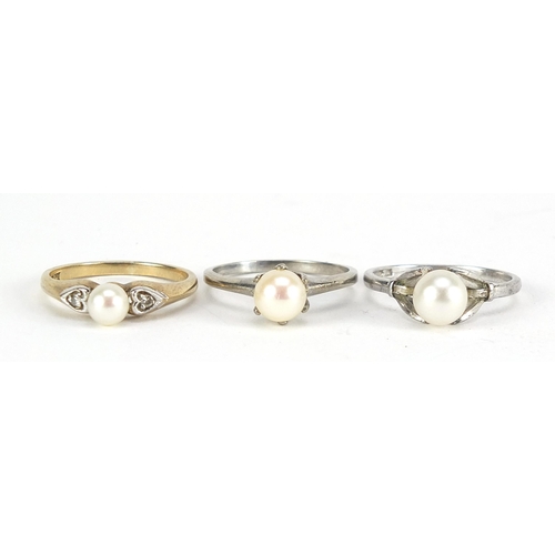 2145 - Three 9ct gold pearl rings including one with diamond shoulders, sizes L and M, total 5.6g