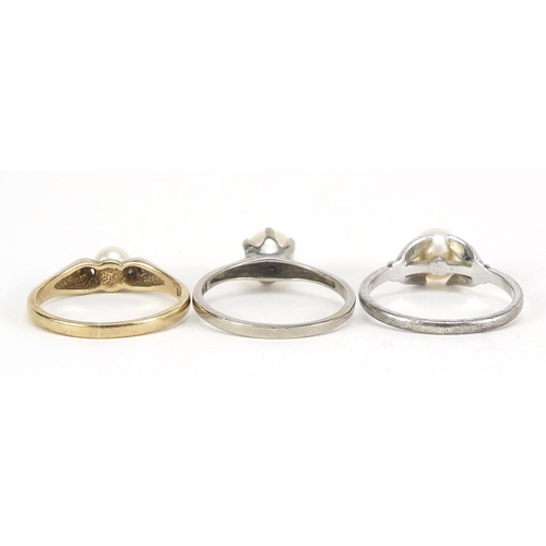 2145 - Three 9ct gold pearl rings including one with diamond shoulders, sizes L and M, total 5.6g