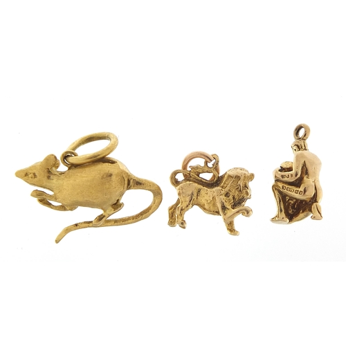 1724 - Three 9ct gold charms comprising rat, lion and nude male water carrier, the largest 2.3cm wide, tota... 