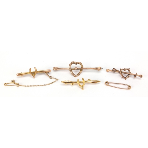 1718 - Four Victorian and later 9ct gold bar brooches comprising two love hearts and two wishbones, the lar... 