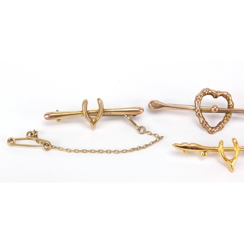 1718 - Four Victorian and later 9ct gold bar brooches comprising two love hearts and two wishbones, the lar... 