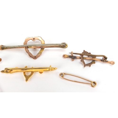 1718 - Four Victorian and later 9ct gold bar brooches comprising two love hearts and two wishbones, the lar... 