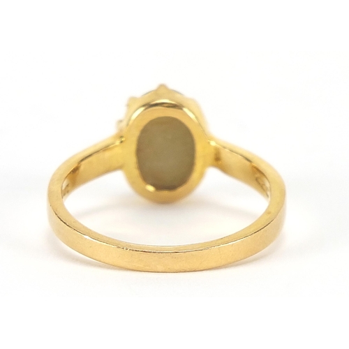 1753 - Gold cabochon cat's eye ring, indistinct marks, (tests as 15ct+ gold) size S, 5.4g