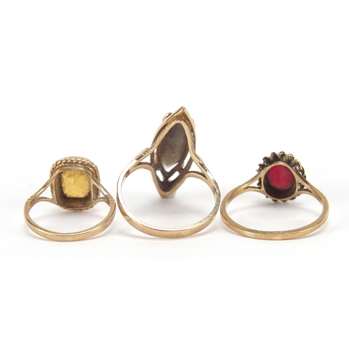 1727 - Three 9ct gold rings set with garnet, citrine and smoky quartz, sizes K, S and U, 10.0g