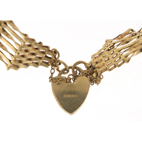 1734 - 9ct gold seven row gate link bracelet with love heart padlock, 18cm in length, 8.2g