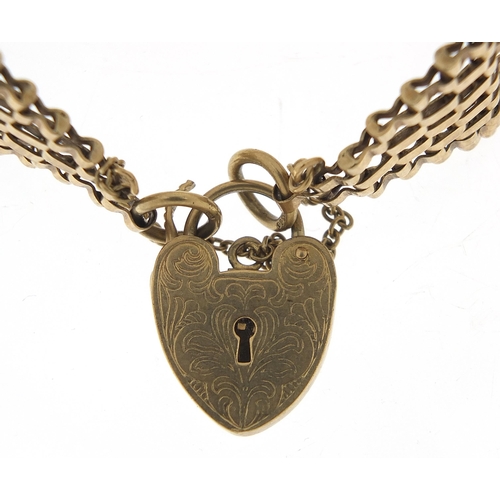 1731 - 9ct gold seven row gate link bracelet with love heart padlock, 16cm in length, 26.0g