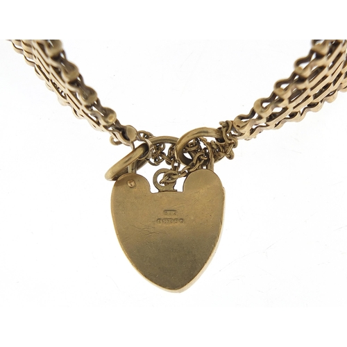 1731 - 9ct gold seven row gate link bracelet with love heart padlock, 16cm in length, 26.0g