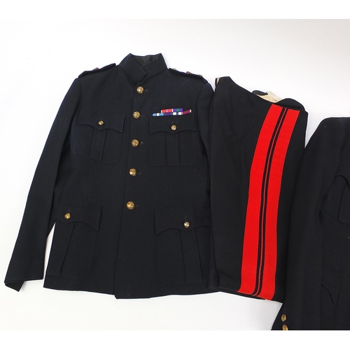 2462A - Two military interest Life Guard's black uniforms with peak cap, shoulder tabs on one uniform holdin... 