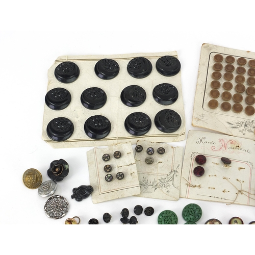 294 - Antique and later buttons including Bakelite, Art Deco and brass examples