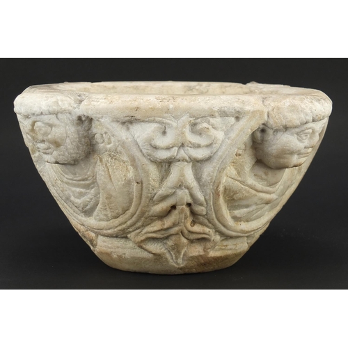 157 - **WITHDRAWN** Antique white marble baptism font carved with faces, possibly Roman or Greek, 14.5cm h... 