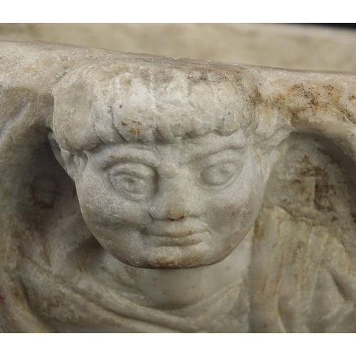 157 - **WITHDRAWN** Antique white marble baptism font carved with faces, possibly Roman or Greek, 14.5cm h... 