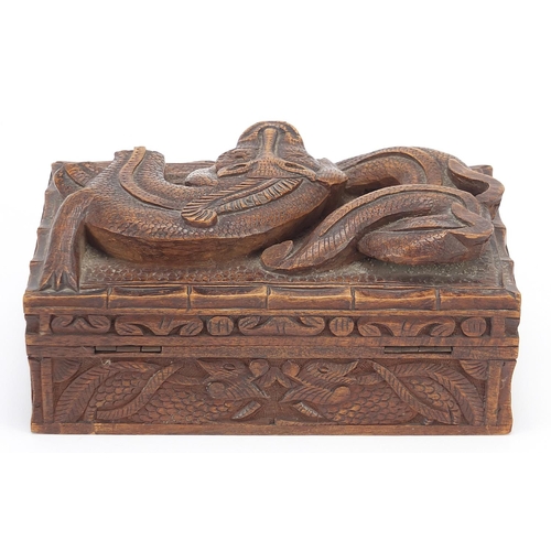 1090 - Chinese hardwood box carved in relief with a mythical animal and dragons, 8.5cm H x 20cm W x 12.5cm ... 