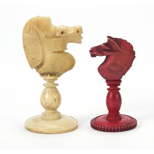 333 - Half stained carved bone chess set and a mahogany case, the largest chess pieces 8.5cm high