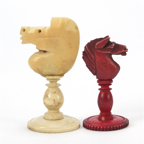 333 - Half stained carved bone chess set and a mahogany case, the largest chess pieces 8.5cm high