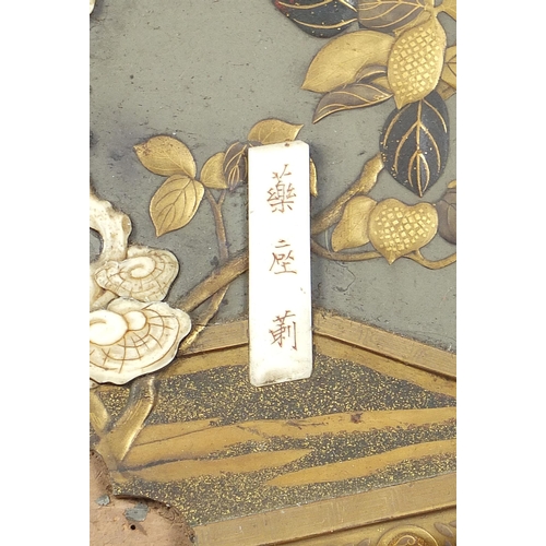 105 - Japanese Shibayama lacquered panel depicting a bird and butterfly amongst flowers, 45.5cm x 33.5cm