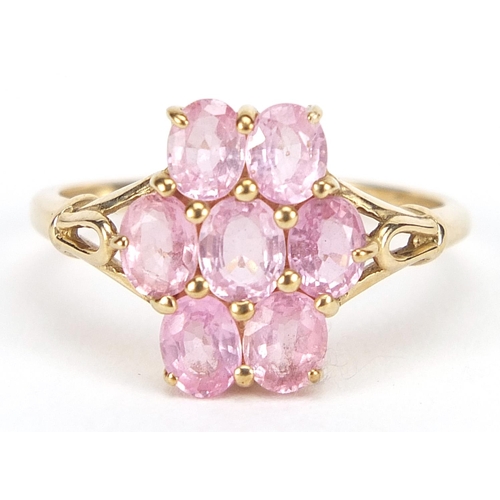 1694 - 9ct gold pink stone cluster ring with pierced shoulders, size N, 2.1g