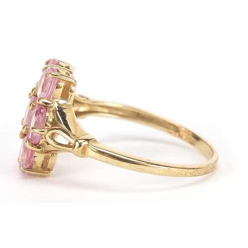 1694 - 9ct gold pink stone cluster ring with pierced shoulders, size N, 2.1g