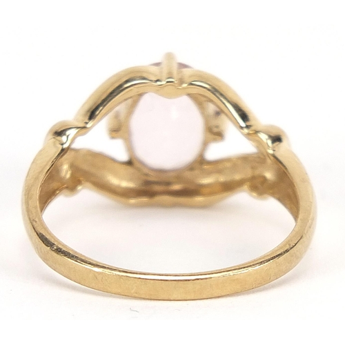 1748 - 9ct gold pink stone ring with pierced setting, size N, 3.0g